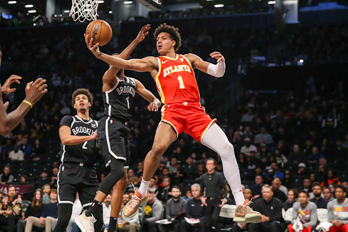 Mar 2, 2024; Brooklyn, New York, USA; Atlanta Hawks forward Jalen Johnson (1) drives past Brooklyn Nets forward Mikal Bridges (1) in the first quarter at Barclays Center. Mandatory Credit: Wendell Cruz-USA TODAY Sports